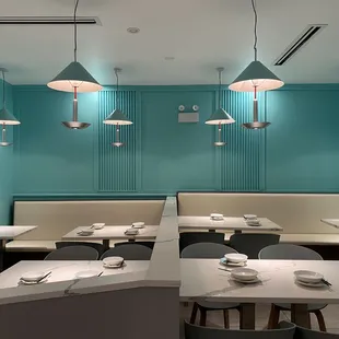 an empty restaurant with blue walls