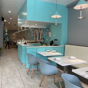 a modern kitchen with blue cabinets