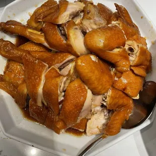 a plate of chicken with sauce
