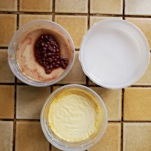 A trio of Taiwanese dessert puddings.  Clockwise from top left:  milk tea, tapioca with taro &amp; coconut milk, flan