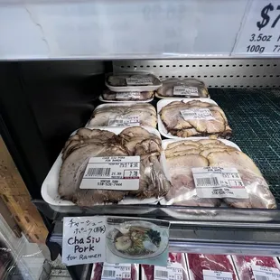 a display of meat in a grocery store