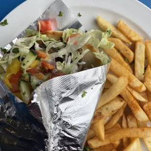 a plate of fries and a salad