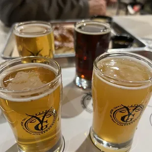 a variety of beers on a tray