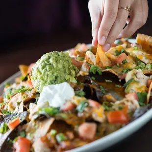 Enjoy over 20 different appetizers, like the Chicken Nachos, while watching your favorite sports games. 