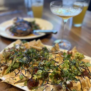 Poke Nachos (foreground) Thai Grilled Pork Chop (background)