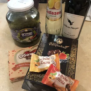 Selection of pickles, drinks, wine and sweets