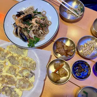 Beef pancake, seafood udon, and side dishes.