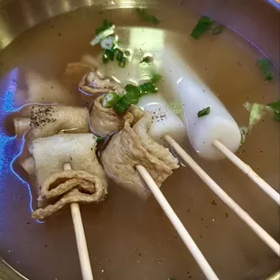 Fish cakes and rice cakes served in a flavorful broth.