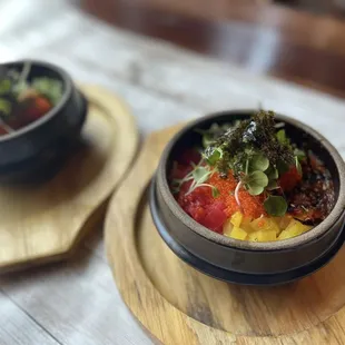 Flying fish roe, stir-fried kimchi, and fresh vegetables in a hot pot.