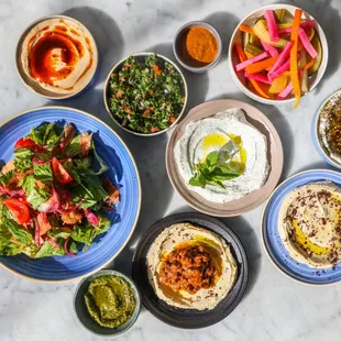 a variety of dishes of food on a table