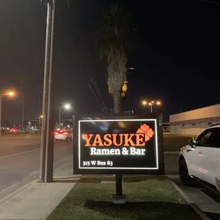 a sign for yasuke ramen and bar