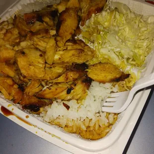 chicken and rice in a styrofoam container