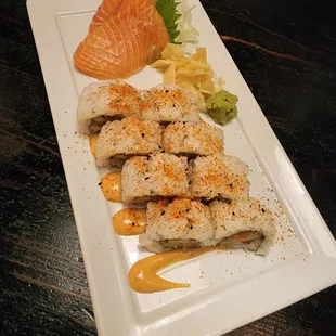 Spicy rolls and salmon sashimi