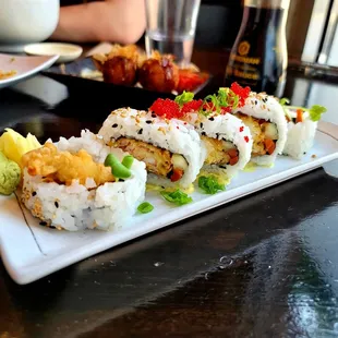 a plate of sushi rolls