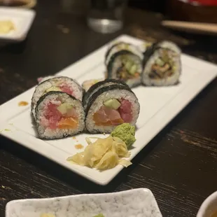 a plate of sushi and a cup of tea