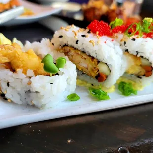 a plate of sushi rolls