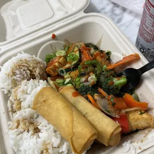 Basil tofu plate with spring rolls. I added soy sauce and sriracha on top