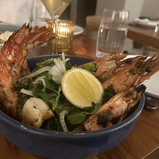 Grilled Head On Prawns Entree on top of an herb salad