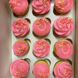 a box of pink cupcakes