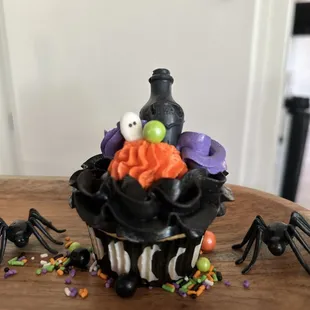 a cupcake decorated with halloween decorations