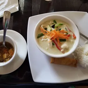 Daily soup and green curry with chicken and side of white rice. Dish included the fried roll.