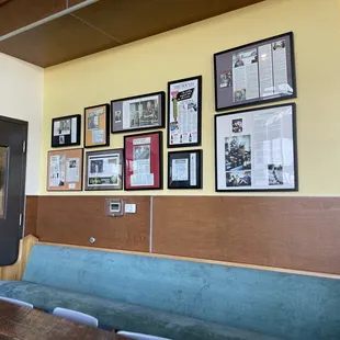 a wall full of framed photos