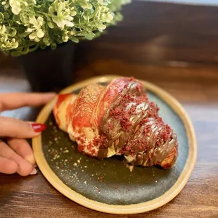 a croissant on a plate