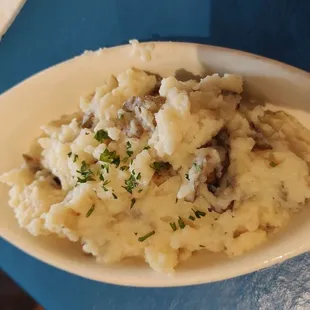 a plate of mashed potatoes and gravy