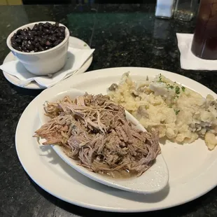 Black beans and rice. Pork and garlic mashed.