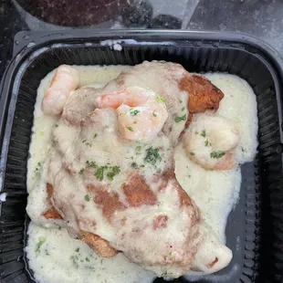 Grouper Supreme. Fried grouper with shrimp and creamy white wine sauce. Comes  with 2 sides.