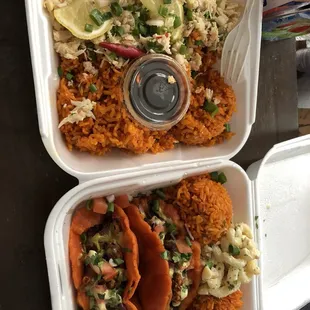 two takeout containers of mexican food