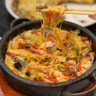 Pizza Kimchi Shrimp Dolsot~ This Bibimbap is ooey gooey cheesy, check the cheese pull! And the shrimp is fresh.