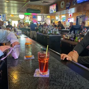 two people sitting at a bar