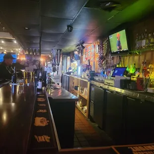 a bar with a television on the wall