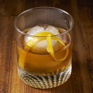 a glass of old fashioned whiskey