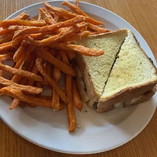 Philly cheesesteak sandwich and sweet potato fries