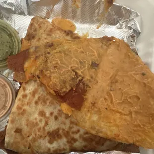 "cheese" quesadilla from the menu. comes with meat on it.