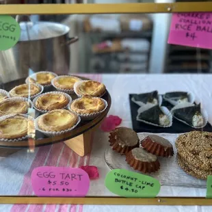 Egg tart, tea egg, rice ball, sesame chop cookie, coconut lime bottle cap