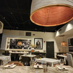 a dining room with tables and chairs