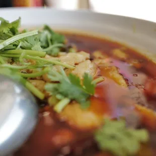 a bowl of soup with a spoon