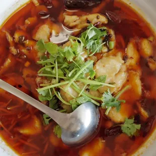 a bowl of soup with a spoon