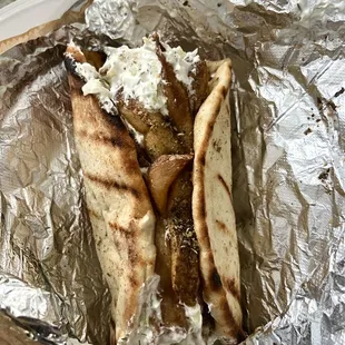 two pita breads wrapped in tin foil