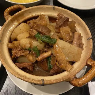 a bowl of stew with meat and vegetables