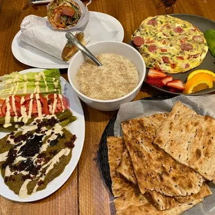 Top: Sossis Bandari Sandwich, The Whole Shebang omelet Center: Halim (Weekends Only) Bottom: Eggplant dish comes with Sangak bread