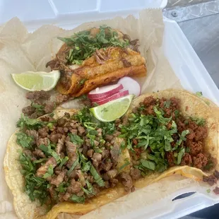 two tacos in a styrofoam container