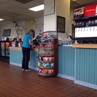 a woman standing at a counter