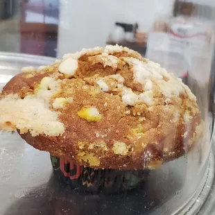 a muffin in a glass case
