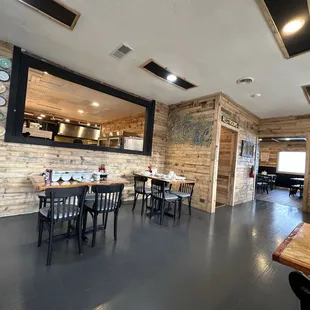 a restaurant with tables and chairs