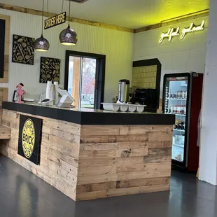 a kitchen with a bar