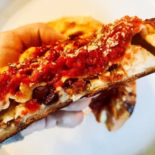 Inside of the XS deep dish pizza. They do allow for a couple custom items to be added in!